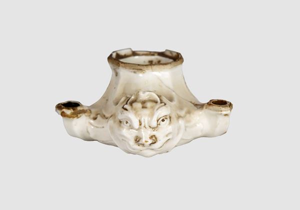 Glazed majolica oil lamp with central mask