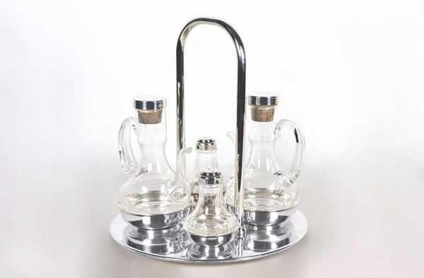 Silver metal table set with two cruets for oil and vinegar, pepper and salt shaker