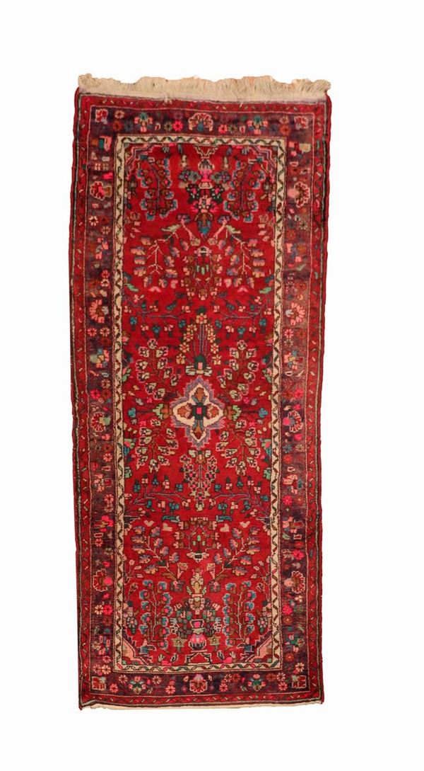 Persian Karadagh carpet with guide motifs of floral medallions and flowers on a red background, 2.15 x 0.97 m