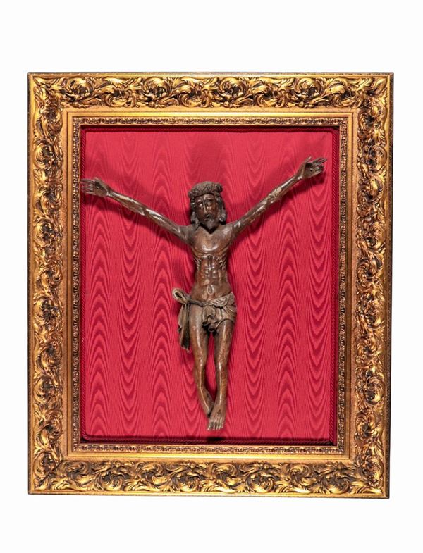 Antique crucifix in patinated and carved wood