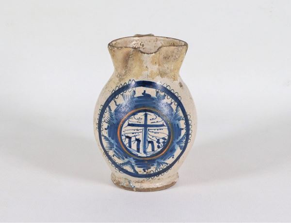 Enamelled majolica jug with blue decorations, defects, restorations and felature