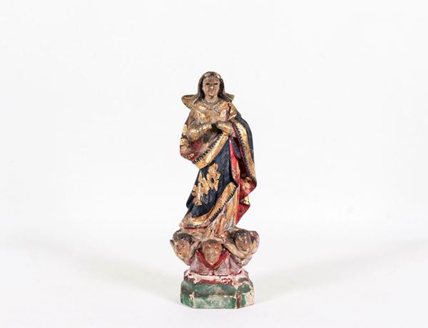 Ancient small sculpture "Madonna" in polychrome wood, defects and shortcomings