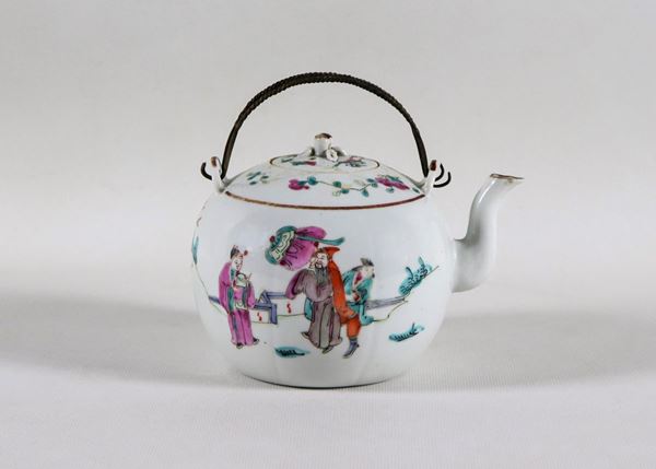 Antique Chinese porcelain teapot with colorful decorations in relief enamels with oriental life motifs