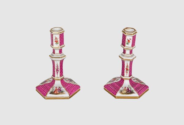 Pair of antique small candlesticks in Old Berlin porcelain, colorful with gallant scenes and bunches of flowers