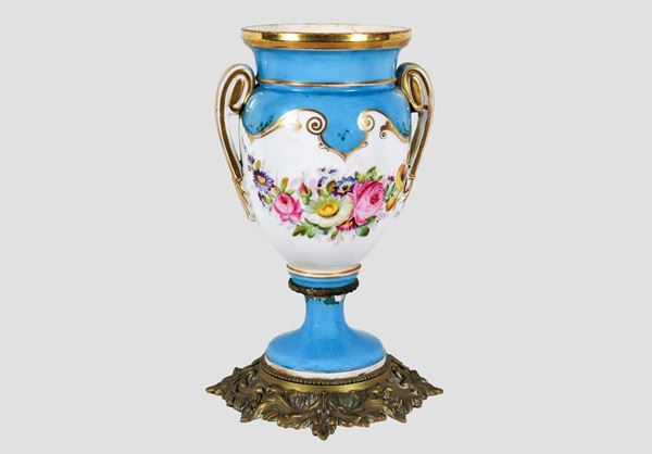 Antique French amphora vase in light blue and gold porcelain with polychrome decorations with bunches of flowers, gilt bronze base