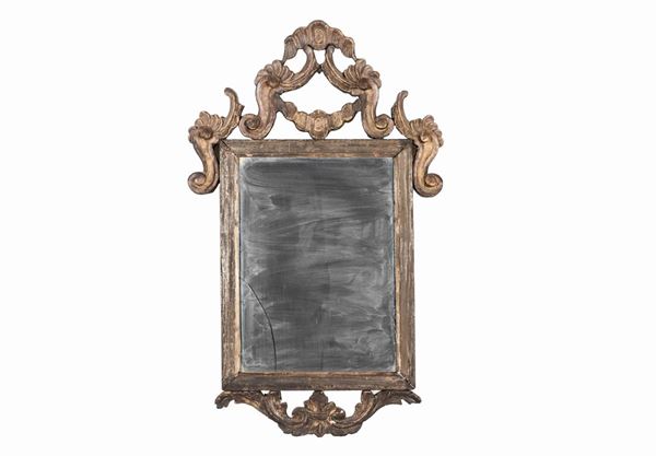 Antique Venetian mirror in patinated wood with molding and carved friezes with Louis XV motifs
