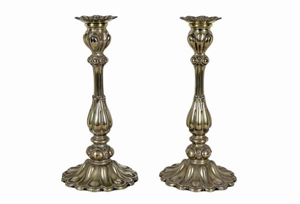 Pair of chiseled and embossed Sheffield candlesticks