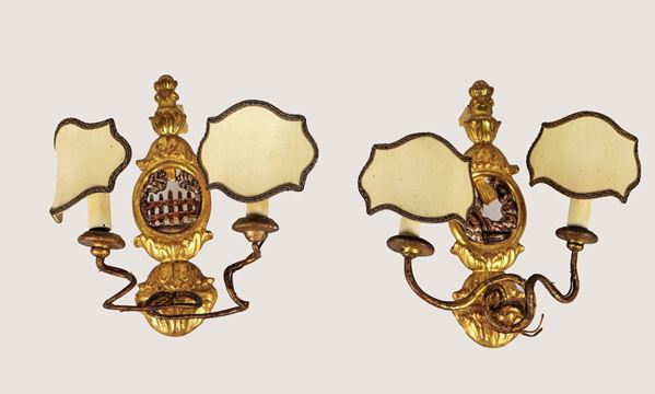 Pair of small appliques in gilded and carved wood with intertwined arms, 2 lights each