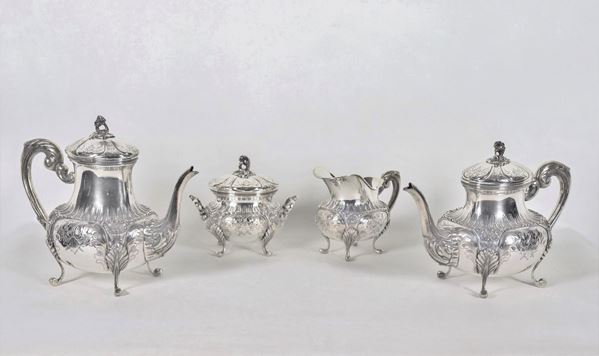 Tea and coffee service in chiseled and embossed silver with Louis XV motifs of floral scrolls, shells and palmettes (4pcs) gr. 3150