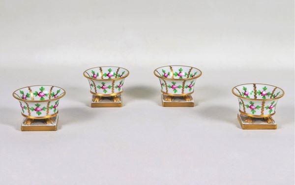 Four Herend porcelain salt cellars decorated with colorful roses and leaves motifs