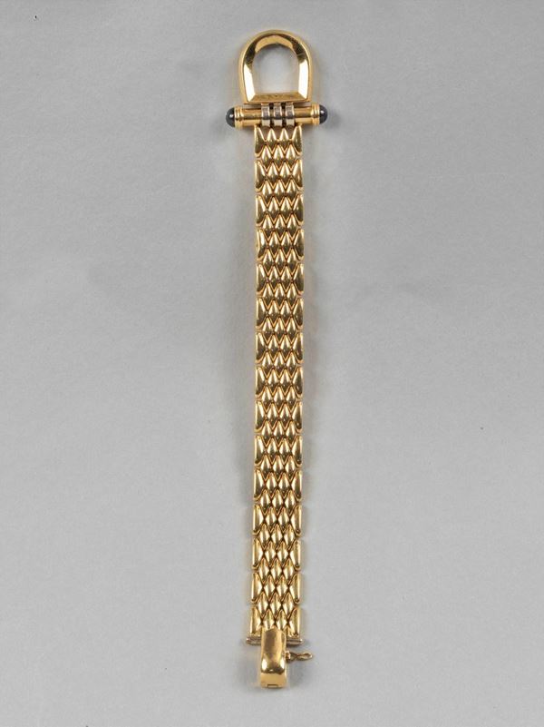 750 yellow gold soft link bracelet with 2 cabochon-cut semiprecious gems. Approximately 42.30 grams
