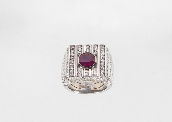 750 white gold ring with central ruby and brilliant cut diamonds pave. Approx. 17.50 g, Ruby Ct. About 2.50, diamonds Ct. About 2.30. Measure 14.