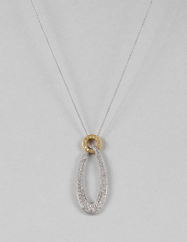 750 white gold necklace with oval pendant in white gold and yellow gold with brilliant cut diamonds pave. About 8.80 grams - Ct. About 1.50.