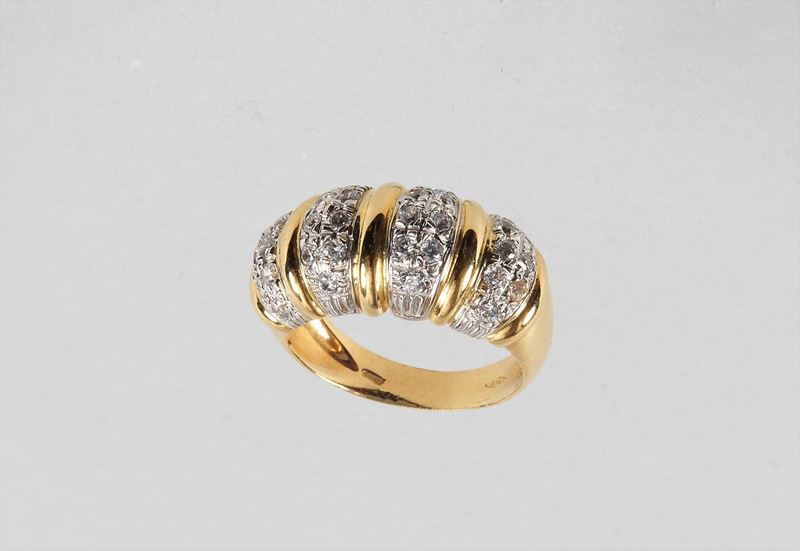 Anello in oro giallo 750 con serie di zirconia cubica. Gr. 9,50 circa, misura 18.