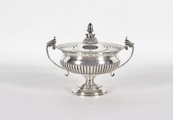 Silver sugar bowl in the shape of a chiseled and embossed amphora with two curved handles gr. 265