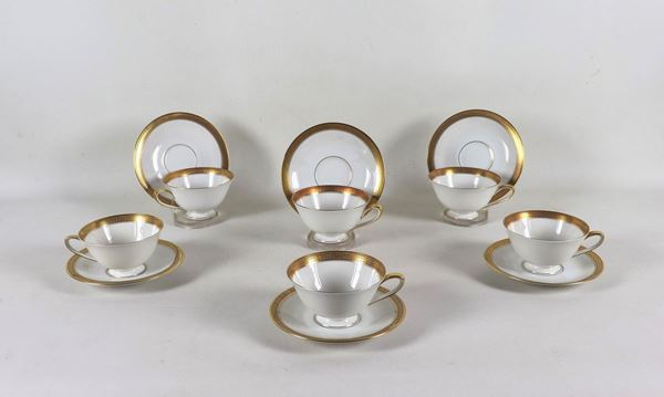 Lot of six teacups and saucers in German white porcelain with handles and edges in pure gold