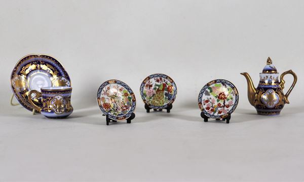 Lot of toys in polychrome porcelain: coffee pot, cup with saucer and three round saucers (5 pcs)