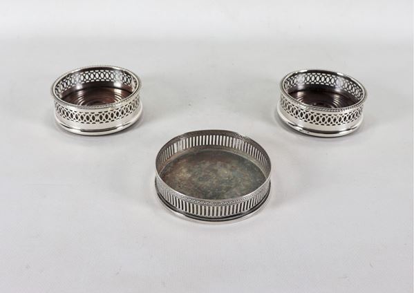 Lot of three coasters in silver-plated and chiseled metal with perforated rails
