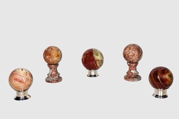 Lot of five spheres in various precious marbles with relative bases