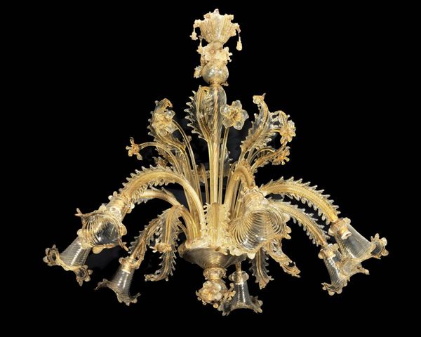 Large amber-colored blown Murano glass chandelier with applications of flowers, leaves and curls, 7 lights