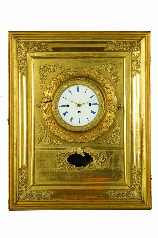 Wall clock in gilded wood