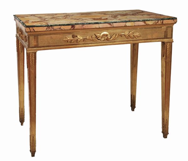 Antique console in gilded wood of the Louis XVI line with carvings with motifs of leaves and palmettes, top in veneered brecciated marble