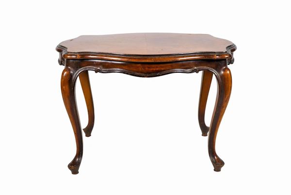 Oval coffee table in walnut