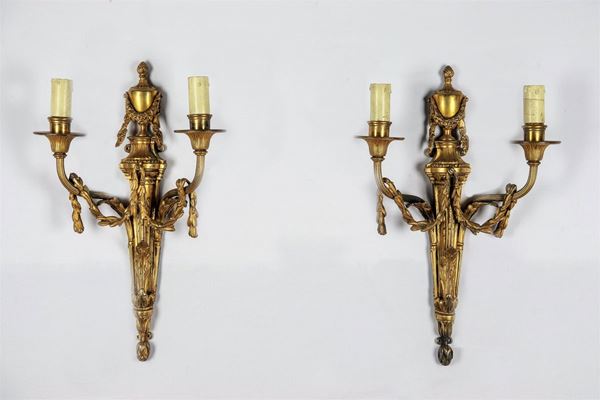 Pair of French Louis XVI line appliques in gilt bronze, embossed and chiseled, 2 lights each