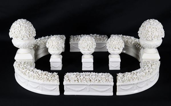 French gardener in white porcelain with floral decorations in relief (11 pcs)