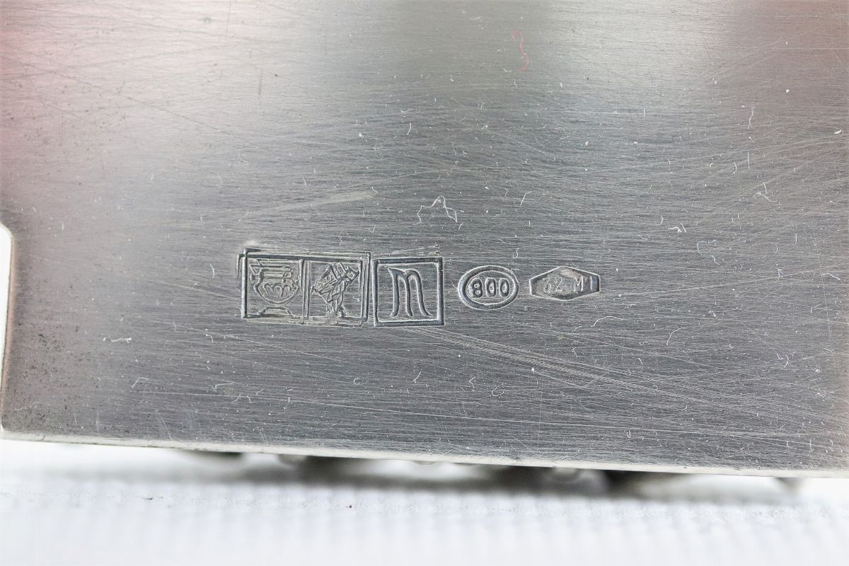 Candelabro in argento con sculture di "Vittorie alate", volute floreali e faretra centrale, gr. 1...