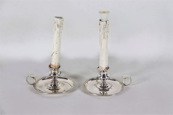 Pair of silver lies with electric light reduction, gr. About 180