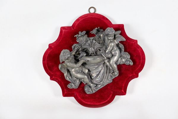 Roman stoup in bronze with cupids sculptures, support in purple red velvet