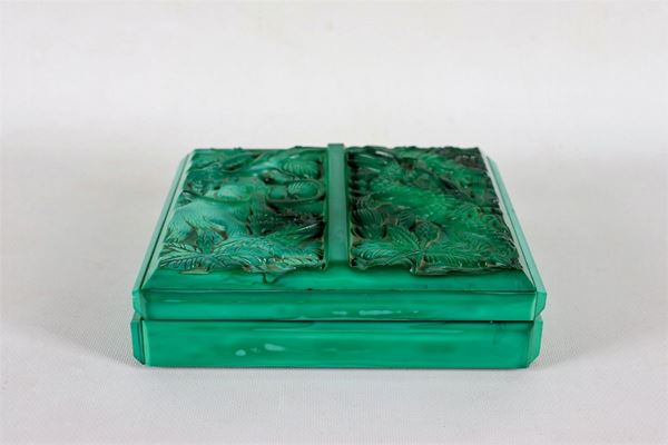 Rectangular box in green glass paste, with lid worked in relief with figures of prehistoric animals
