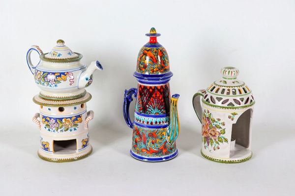 Lot in glazed ceramic with various polychrome colors of a coffee pot, a teapot with warmer and a lie (3 pcs)