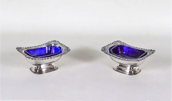 Pair of English sheffield salt cellars with chiselled and embossed edges, cobalt blue crystal trays inside