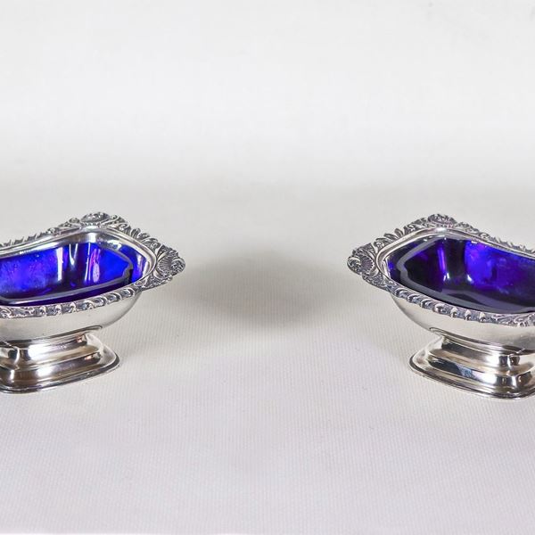 Pair of English sheffield salt cellars with chiselled and embossed edges, cobalt blue crystal trays inside