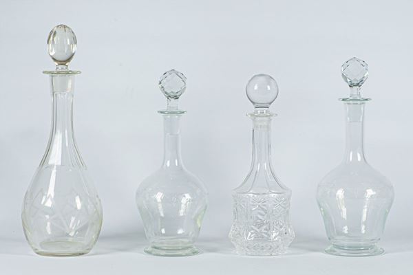 Four crystal bottles for wine