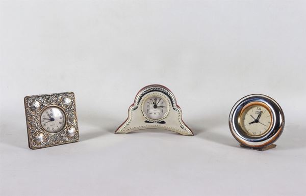 Lot of three small silver-coated table clocks