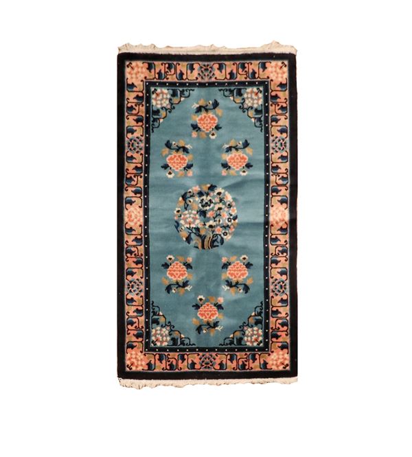 Small Chinese carpet with floral motifs on a light blue background and pink borders, M. 1.37 x 0.78