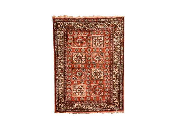 Karabakh carpet with geometric motifs on a red background with light borders, M. 1.48 x 1.04