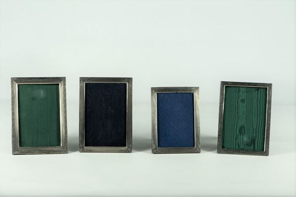 Four picture frames in chiseled silver