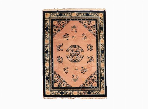 Chinese carpet with havana background with central rosette and blue borders, 2.30 x 1.72 m