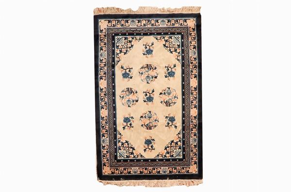 Chinese carpet with a havana and pink background with blue borders, 1.85 x 1.23 m