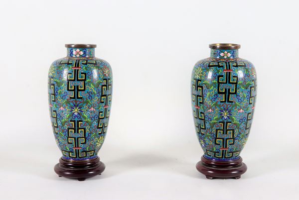 Pair of small Chinese vases in cloisonné enamel, decorated in relief with geometric and floral motifs