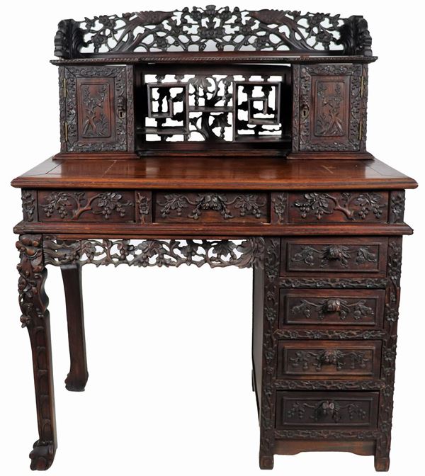 Japanese writing desk in rosewood and ebonized wood, with carvings with motifs of flowers, trees and birds