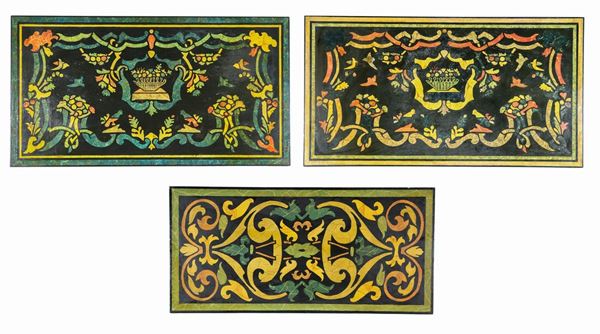 Lot of three rectangular panels in black lacquered wood and faux marble paintings with motifs of scrolls, flowers and vases