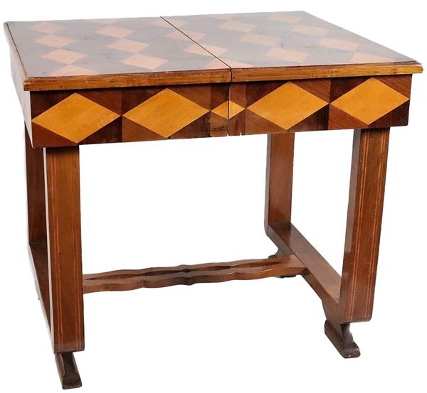Decò extendable center table in walnut, mahogany and cherry with inlays with rhombus motifs, four squared legs joined together by shaped crosspiece