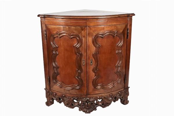 Walnut corner cabinet with two doors with relief carvings