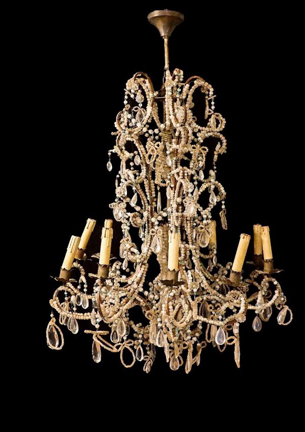 French chandelier of the Louis XV line in bronze with crystal prisms and beads, 11 lights