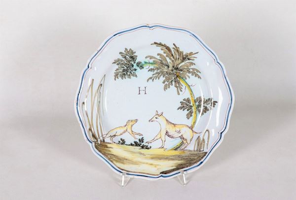 Glazed majolica plate with tree and animal decorations